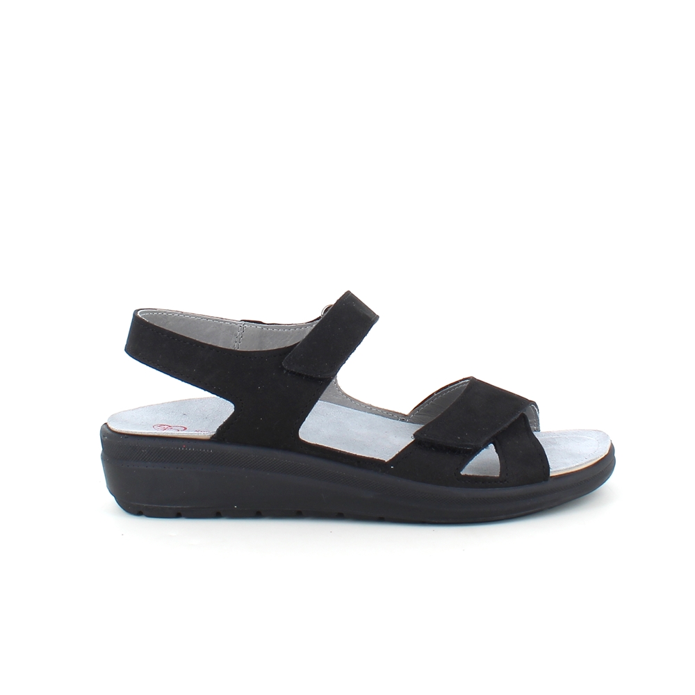Stötdämpande svart sandal med avtagbar sula.