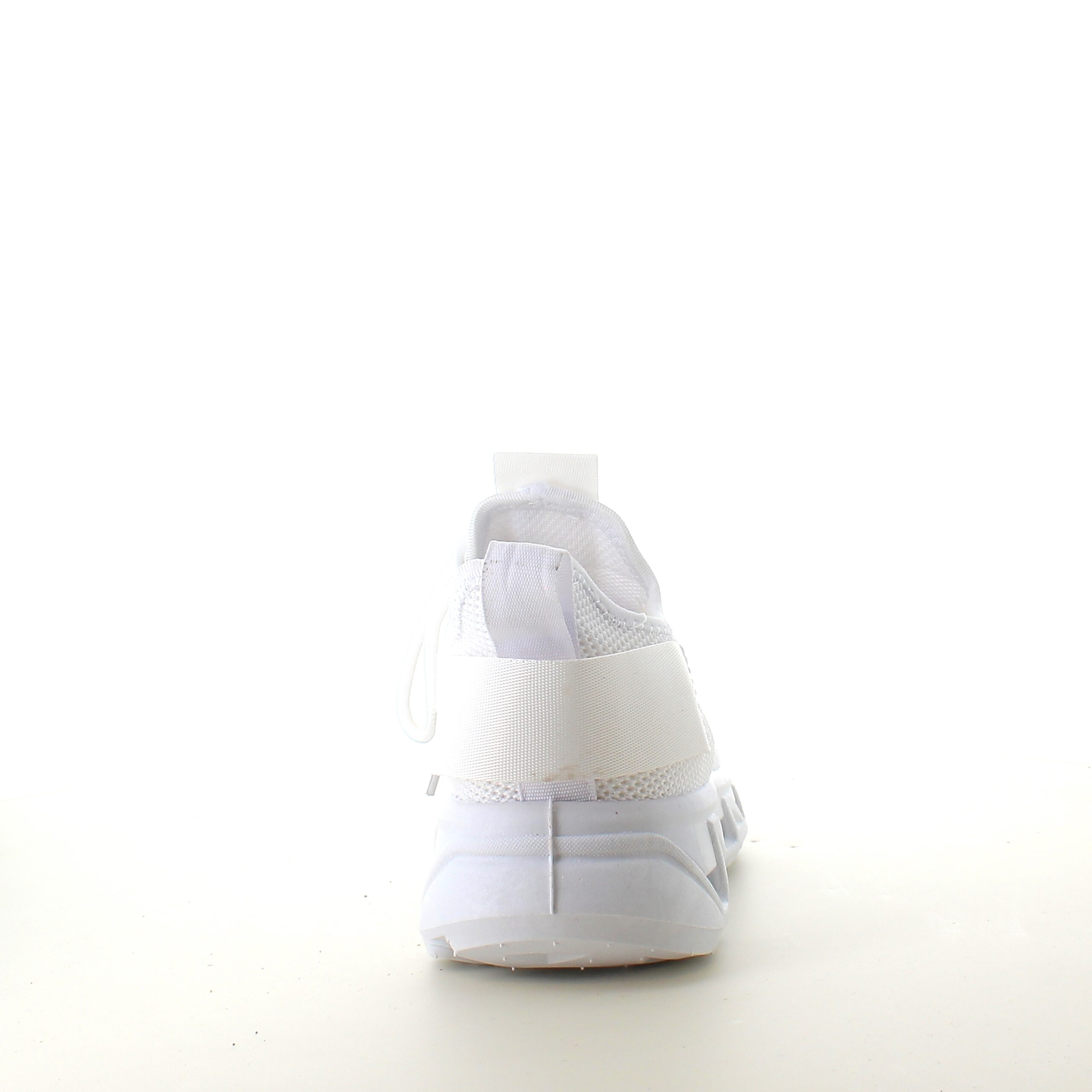 Vita slip-on skor med stickad ovandel